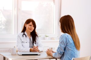 Doctor & patient talking in office