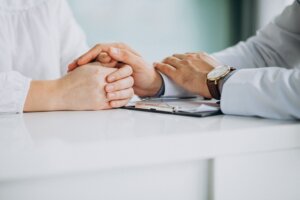 Doctor comforting patient