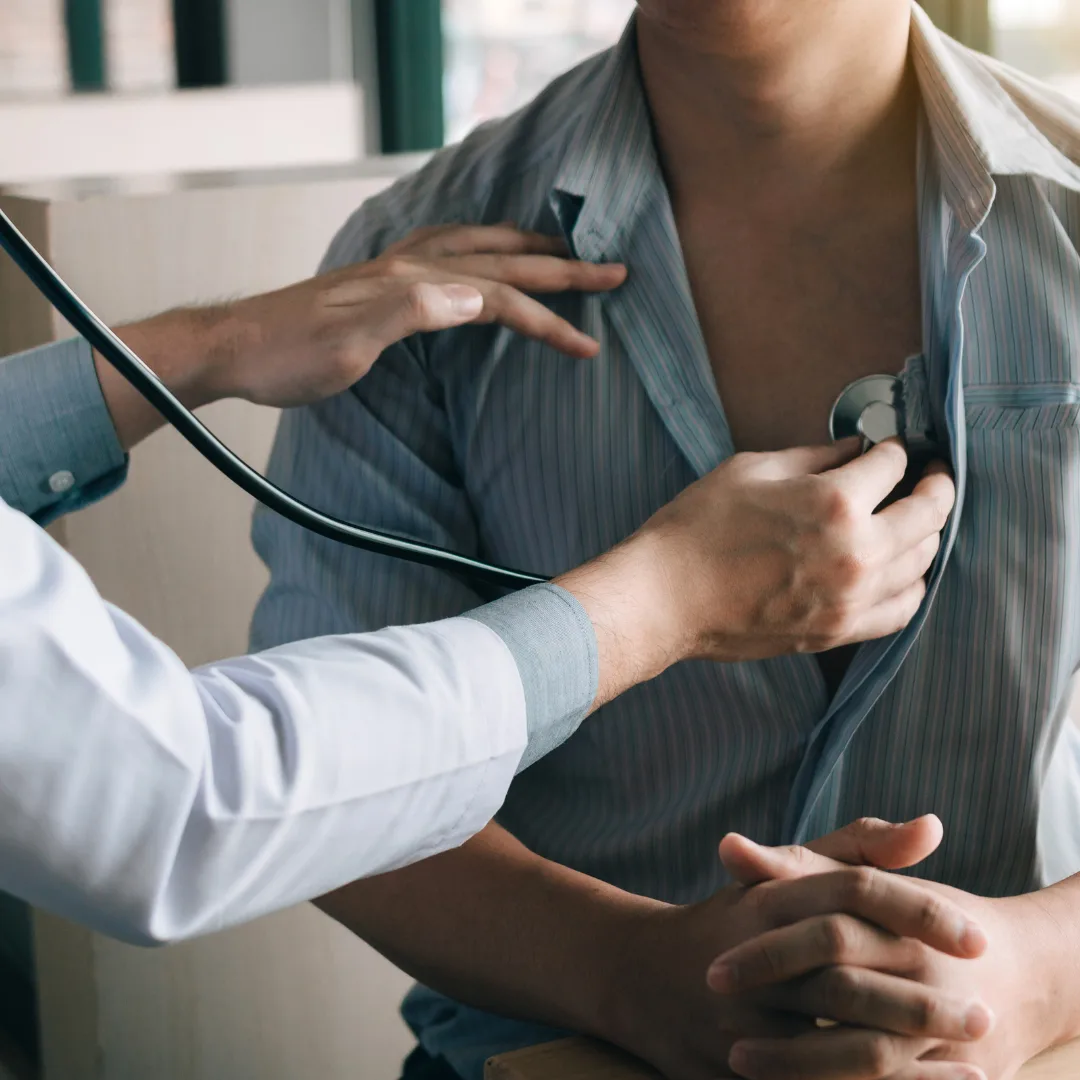 doctor checking a man heart