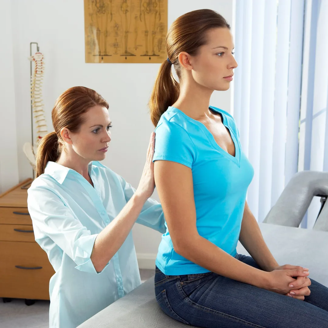 doctor checking a womans back