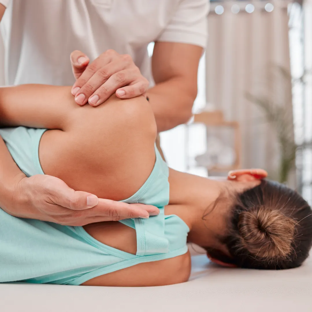doctor fixing a patient back