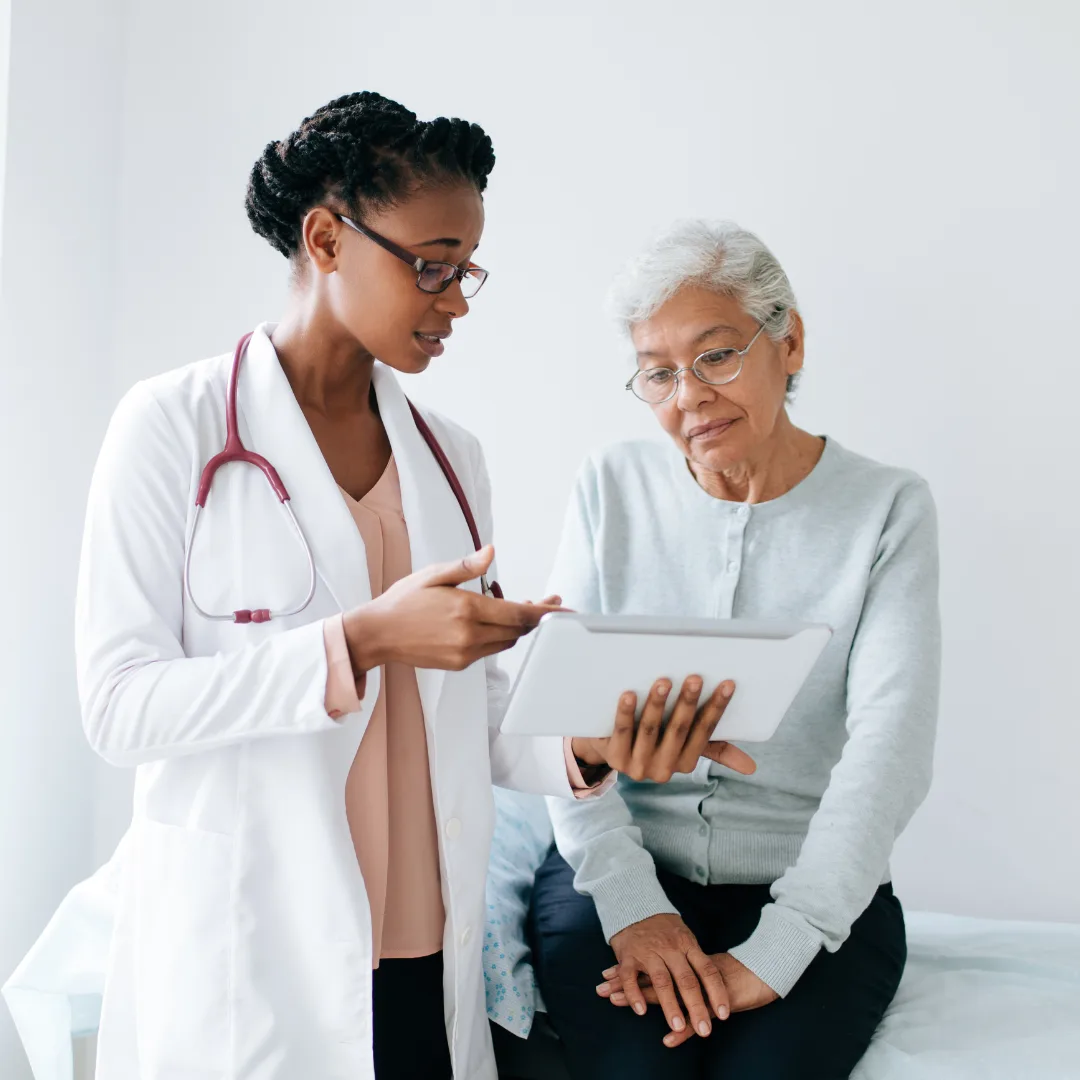 doctor talking to an old lady