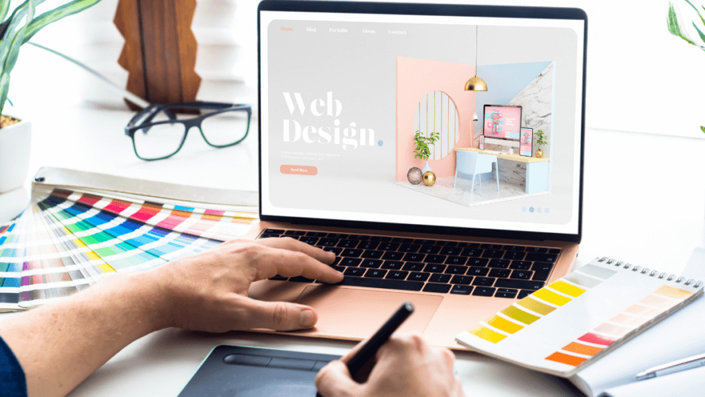 Web designer working on laptop, designing website